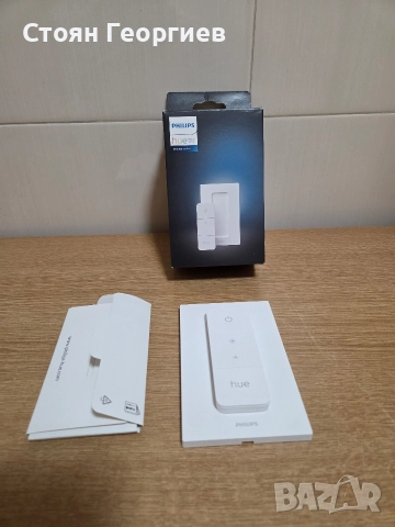 интелигентен димер за осветление Philips Hue (модел 562777). 