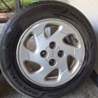 Продавам 4бр 14-ки джанти с летни гуми за Нисан Алмера , снимка 8 - Гуми и джанти - 45470295