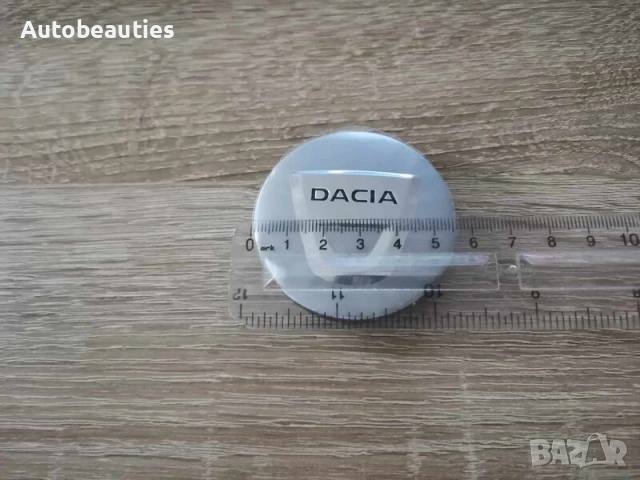 сребристи капачки за джанти за Dacia 56 мм, снимка 3 - Аксесоари и консумативи - 53232392