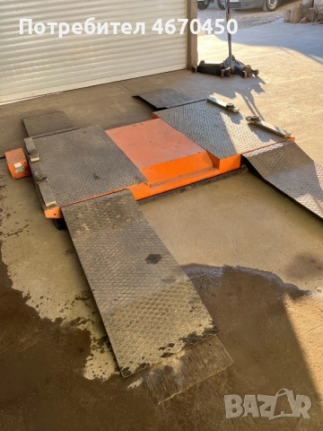 Подемник за смяна на гуми 