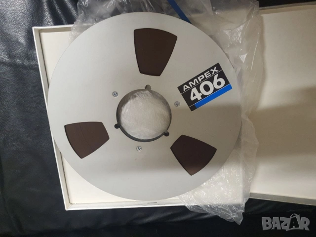 Магнетофонна ролка Ampex 26,5см 10,5" Алуминиева ролка. В много добро състояние. Лентата не цапа. Им
