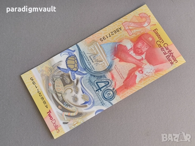 Банкнота - Източни Кариби - 2 долара (юбилейна) UNC | 2023г.
