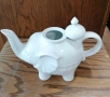 Чайник от бял порцелан, изработен във формата на щастливо слонче с вдигнат хобот и релефни детайли. , снимка 9